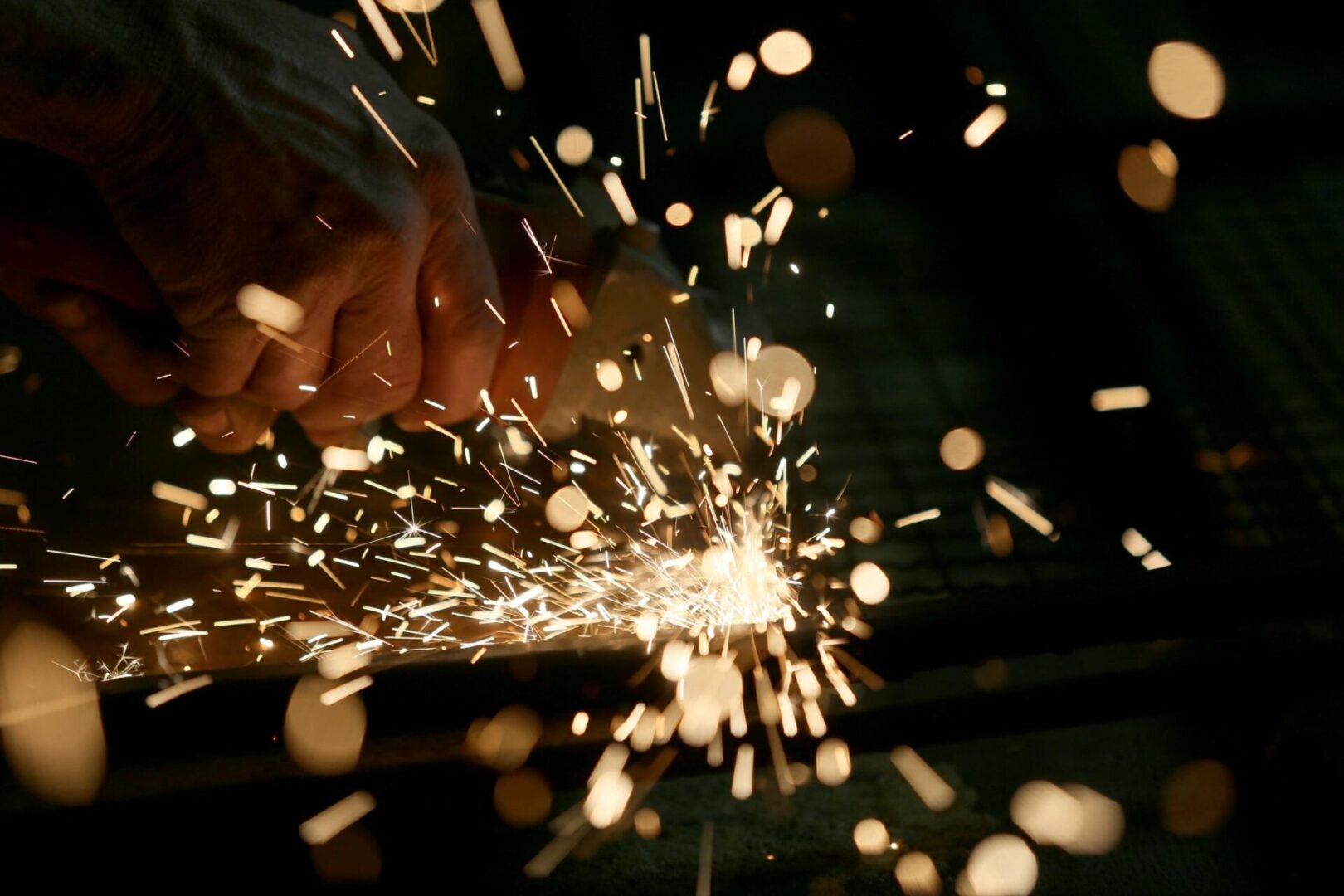 Black background with a close-up of bright welding sparklers